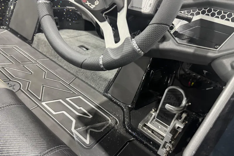 Slide: The Image of 2026 Skeeter FXR20 Apex boat interior with steering wheel and control panel. - 20