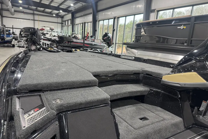Slide: The Image of 2026 Skeeter FXR20 Apex boat interior with spacious deck in showroom. - 26