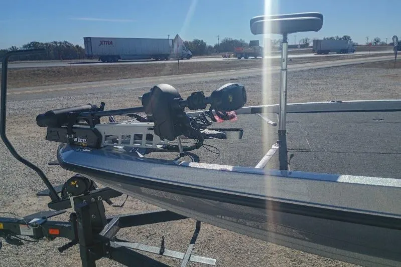 Slide: The Image of 2026 iKon VLS 20 boat on trailer, highway background, sunny day. - 3