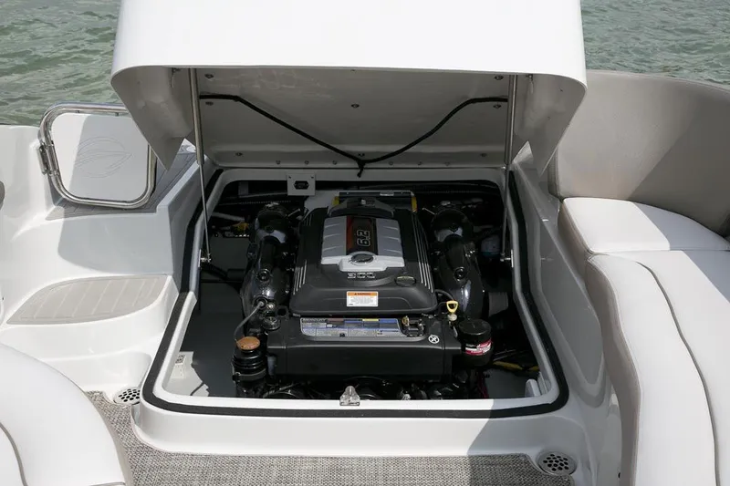 Slide: The Image of Engine compartment of 2026 Crownline Eclipse E255 boat, open for maintenance. - 11