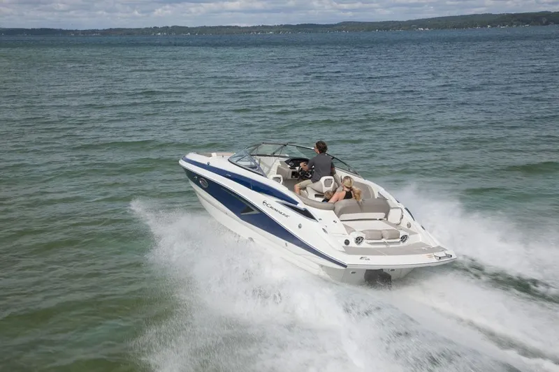 Slide: The Image of 2026 Crownline Eclipse E255 speedboat cruising on open water. - 16