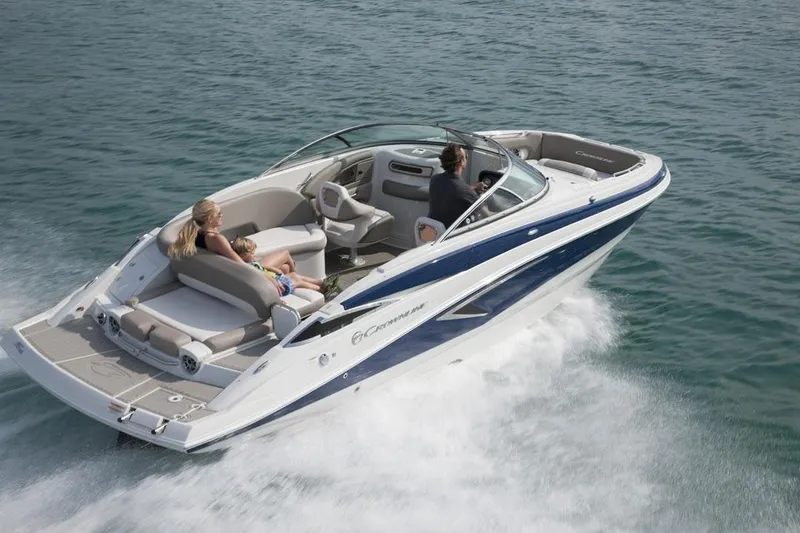 Slide: The Image of 2026 Crownline Eclipse E255 boat cruising on open water with passengers. - 18