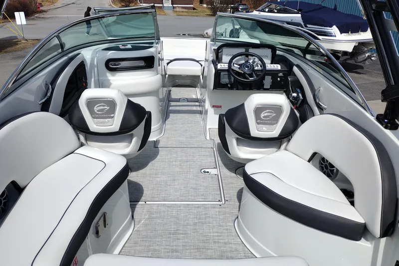 Slide: The Image of 2026 Crownline Eclipse E255 boat interior with sleek seating and modern dashboard design. - 33