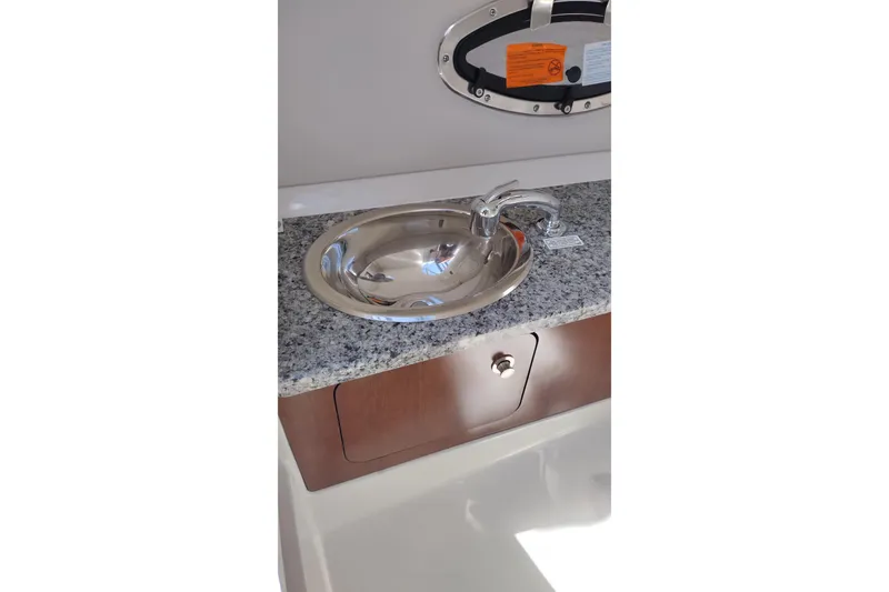 Slide: The Image of Stainless steel sink on granite countertop in 2026 Crownline Eclipse E255 boat. - 39