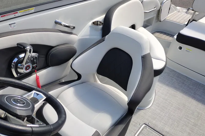 Slide: The Image of Interior of 2026 Crownline Eclipse E255 boat with modern steering and seating. - 42
