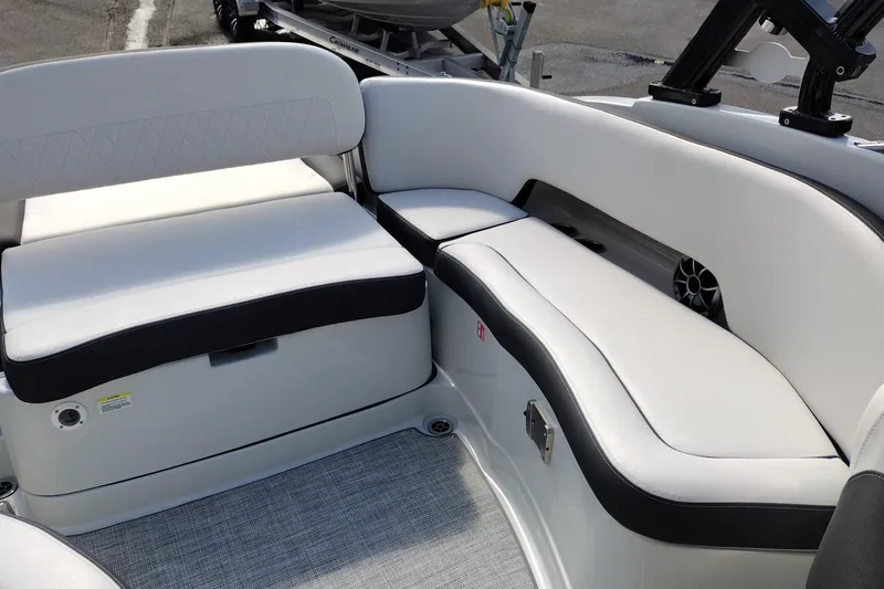 Slide: The Image of 2026 Crownline Eclipse E255 boat interior with white and black seating. - 43