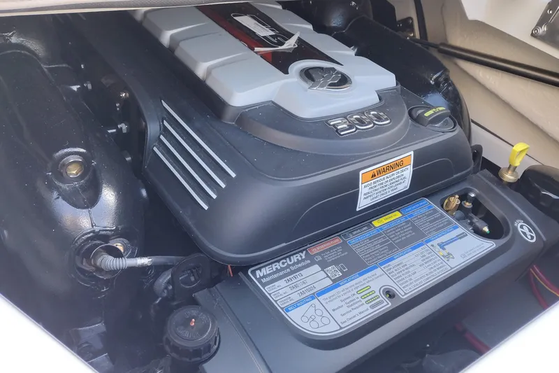 Slide: The Image of Engine compartment of 2026 Crownline Eclipse E255 boat, featuring a Mercury engine. - 45