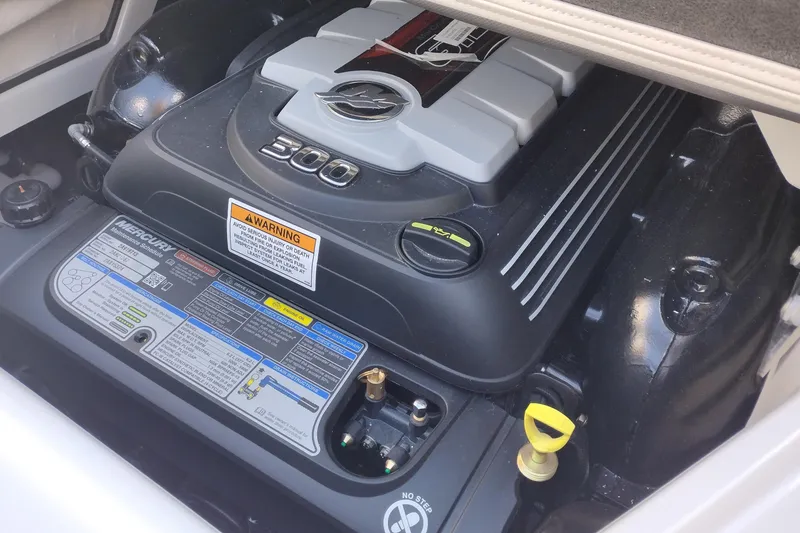 Slide: The Image of Engine compartment of 2026 Crownline Eclipse E255 boat, featuring Mercury 300 horsepower engine. - 46