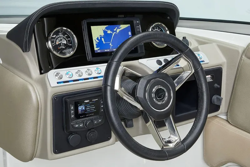 Slide: The Image of 2026 Crownline Eclipse E255 boat dashboard with steering wheel and navigation display. - 6