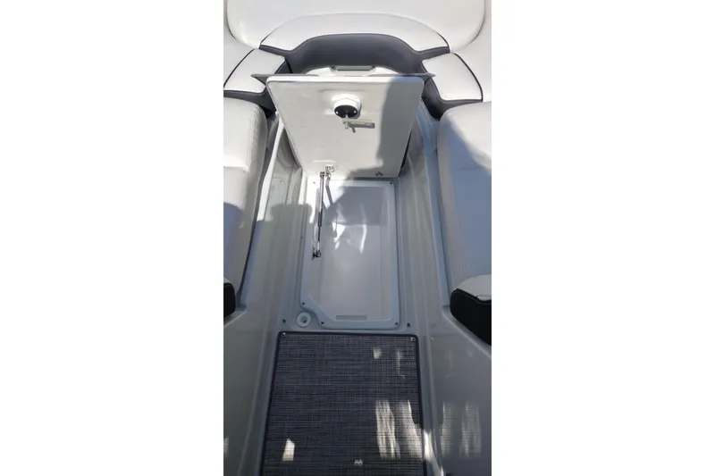 Slide: The Image of 2026 Crownline Eclipse E255 boat interior storage compartment open. - 60