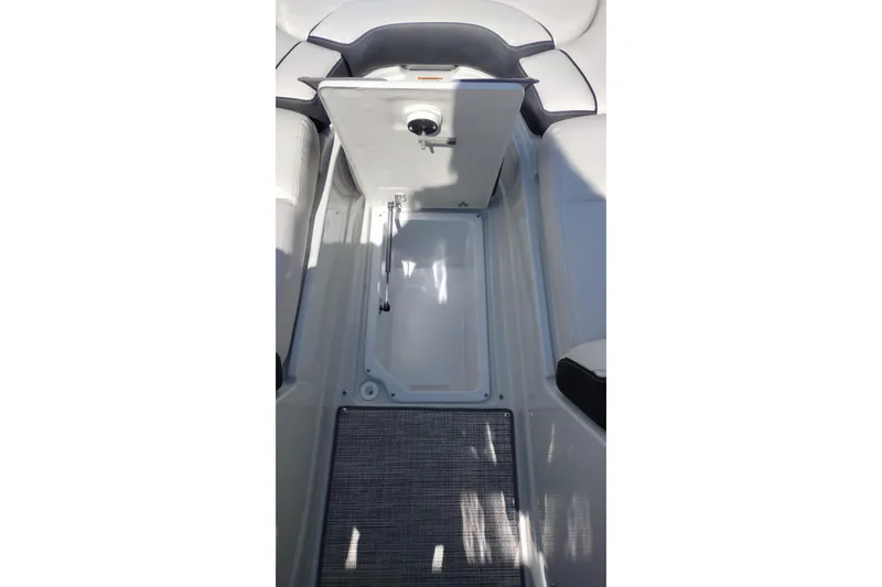 Slide: The Image of 2026 Crownline Eclipse E255 boat interior storage compartment open. - 61