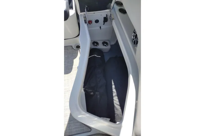 Slide: The Image of Storage compartment in 2026 Crownline Eclipse E255 boat interior. - 62