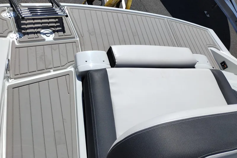 Slide: The Image of 2026 Crownline Eclipse E255 boat deck with seating and ladder. - 63