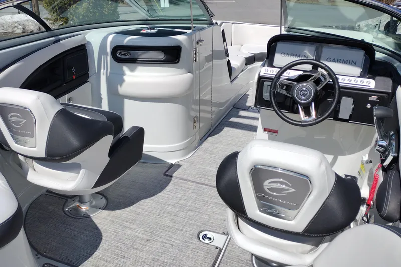 Slide: The Image of Interior of 2026 Crownline Eclipse E255 boat with modern steering and seating. - 65