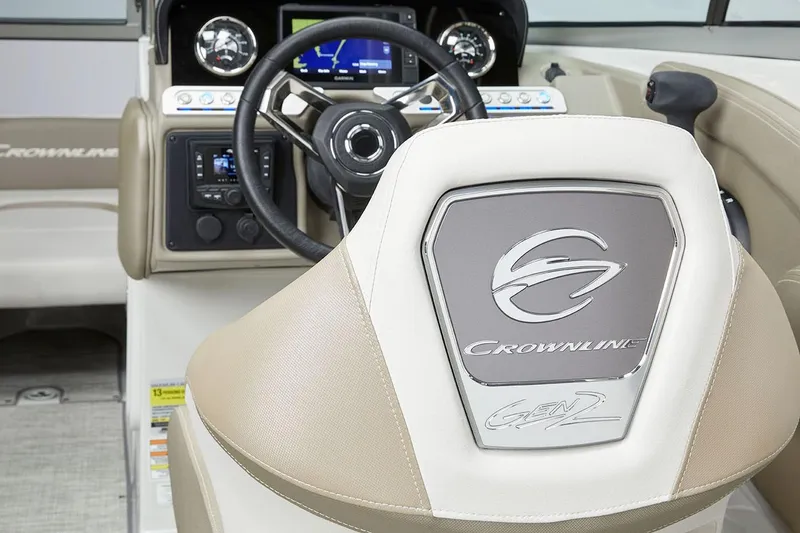 Slide: The Image of 2026 Crownline Eclipse E255 boat interior with steering wheel and dashboard. - 7