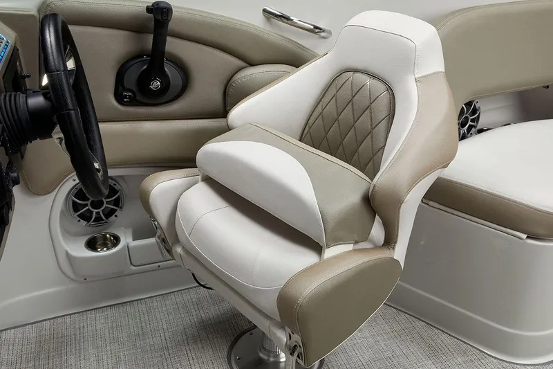 Slide: The Image of 2026 Crownline Eclipse E255 boat interior with luxurious captain's seat and steering wheel. - 8