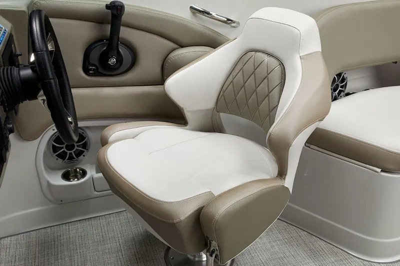 Slide: The Image of 2026 Crownline Eclipse E255 boat interior with luxurious seating and steering wheel. - 9