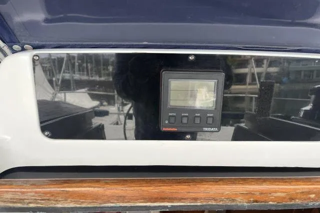 Slide: The Image of Control panel on a 1995 Hunter 336 sailboat, featuring a digital display. - 17