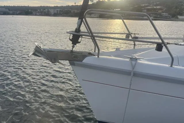 Slide: The Image of Sailboat bow on water at sunset, Hunter 336, 1995 model. - 19