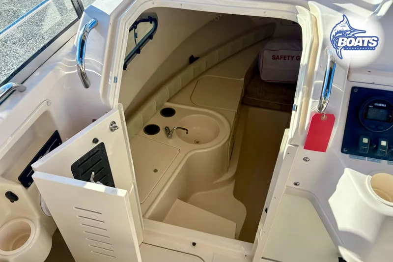 Slide: The Image of 2008 Grady-White Gulfstream 232 cabin interior with sink and safety gear. - 10