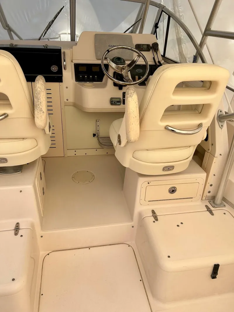 Slide: The Image of 2008 Grady-White 232 Gulfstream WA boat interior with dual helm seats and steering console. - 19