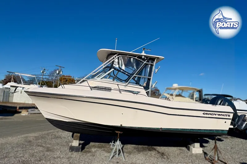 Slide: The Image of 2008 Grady-White Gulfstream 232 boat on display, clear sky background. - 2