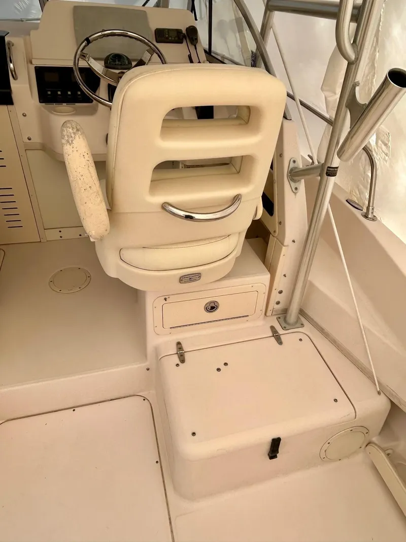 Slide: The Image of 2008 Grady-White 232 Gulfstream WA boat interior with helm seat and steering wheel. - 20