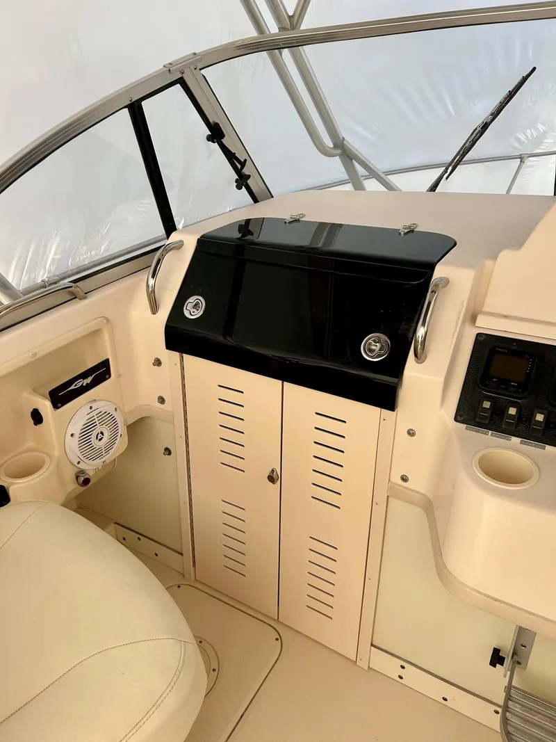 Slide: The Image of 2008 Grady-White 232 Gulfstream WA boat interior with helm and seating. - 22