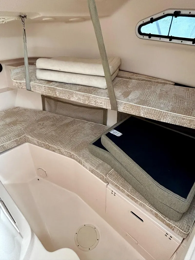 Slide: The Image of Interior cabin of 2008 Grady-White 232 Gulfstream WA boat with cushioned seating. - 24