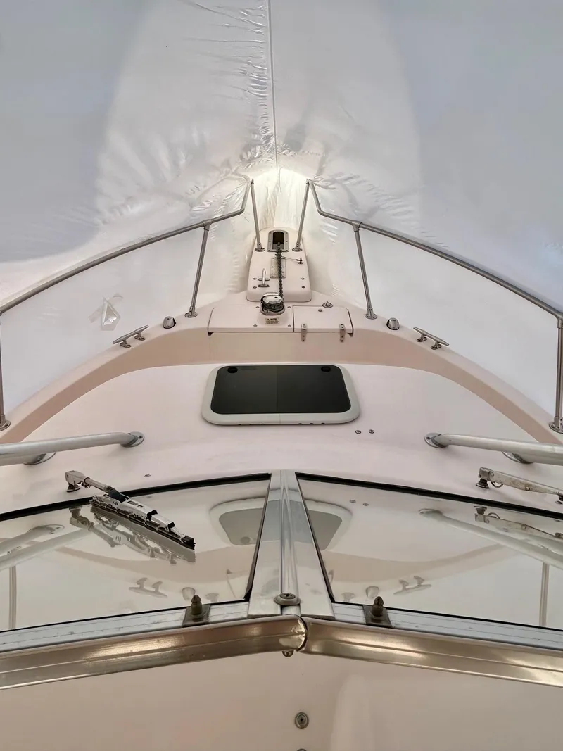 Slide: The Image of 2008 Grady-White 232 Gulfstream WA boat under cover, view from bow. - 29