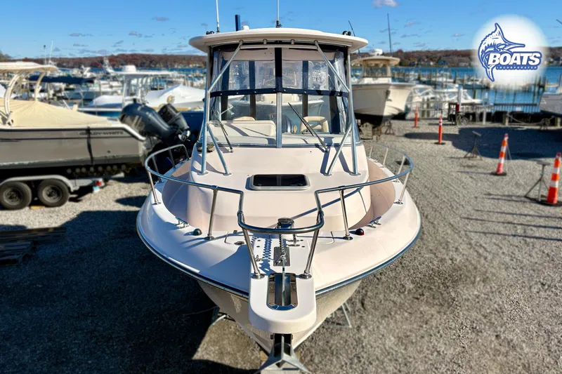 Slide: The Image of 2008 Grady-White Gulfstream 232 boat docked in a marina, front view. - 3