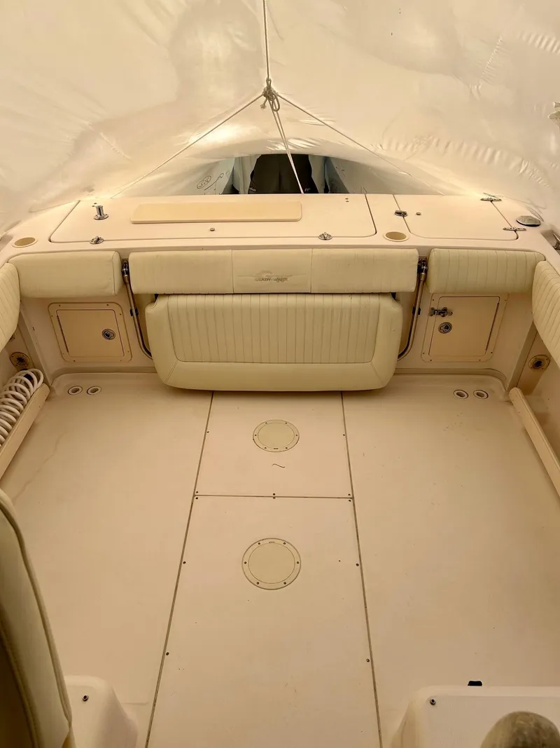 Slide: The Image of 2008 Grady-White 232 Gulfstream WA boat interior, spacious deck under canopy. - 31