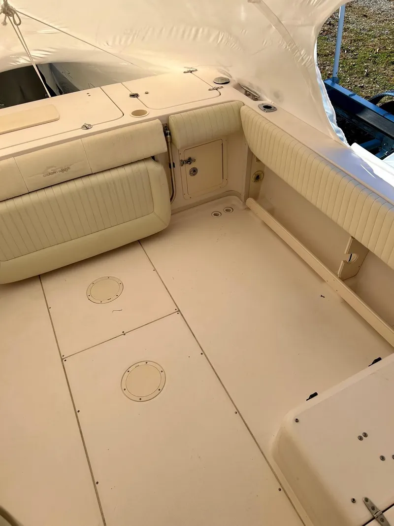 Slide: The Image of 2008 Grady-White 232 Gulfstream WA boat interior, spacious deck with cushioned seating. - 32
