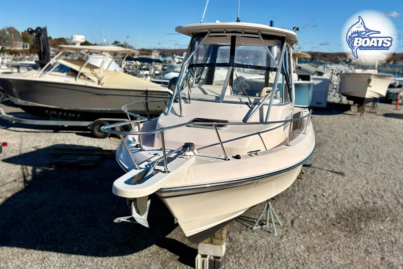 Slide: The Image of 2008 Grady-White Gulfstream 232 boat on display at a marina. - 4