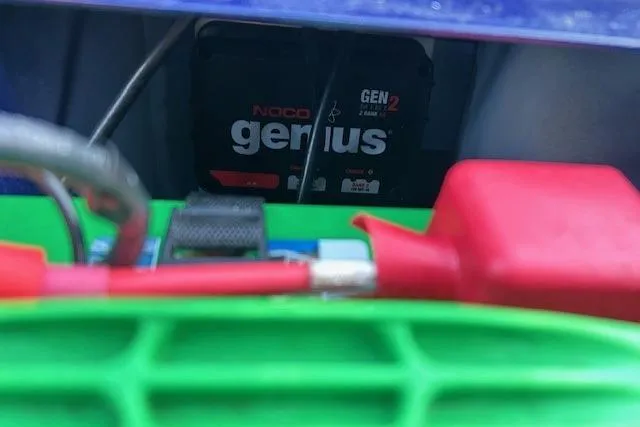 Slide: The Image of 2020 Tracker Pro Team 175 TF with NOCO Genius GEN2 battery charger visible. - 14