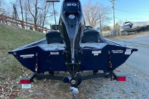 Slide: The Image of 2020 Tracker Pro Team 175 TF boat with 60 HP engine, parked on a trailer. - 15