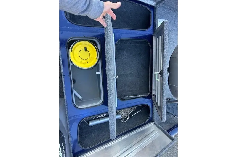 Slide: The Image of 2020 Tracker Pro Team 175 TF boat storage compartments with fishing gear and accessories. - 6