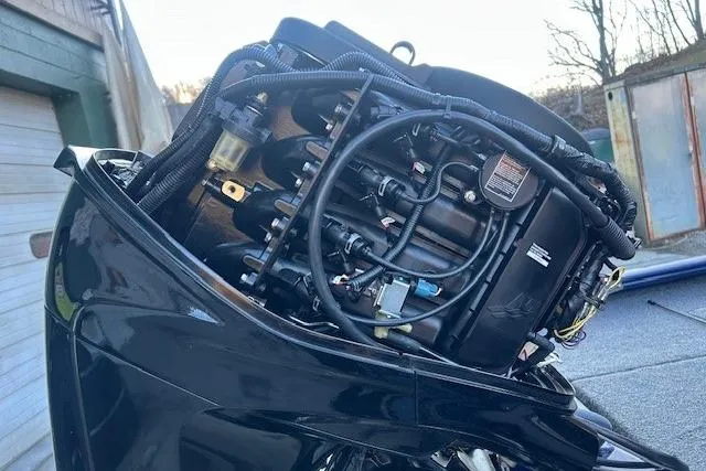 Slide: The Image of 2020 Tracker Pro Team 175 TF boat engine close-up, showcasing intricate wiring and components. - 7