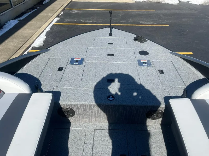 Slide: The Image of 2025 Lowe Deck SD224 boat interior with seating and storage compartments. - 12