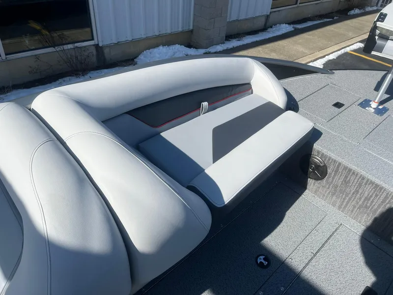 Slide: The Image of 2025 Lowe Deck SD224 boat seating area with modern design and gray upholstery. - 9