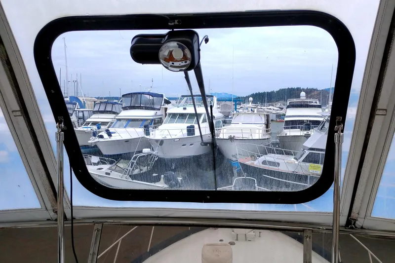 Slide: The Image of View from Ocean Alexander 1985 Custom Aft Deck Motoryacht, overlooking marina with multiple boats. - 18