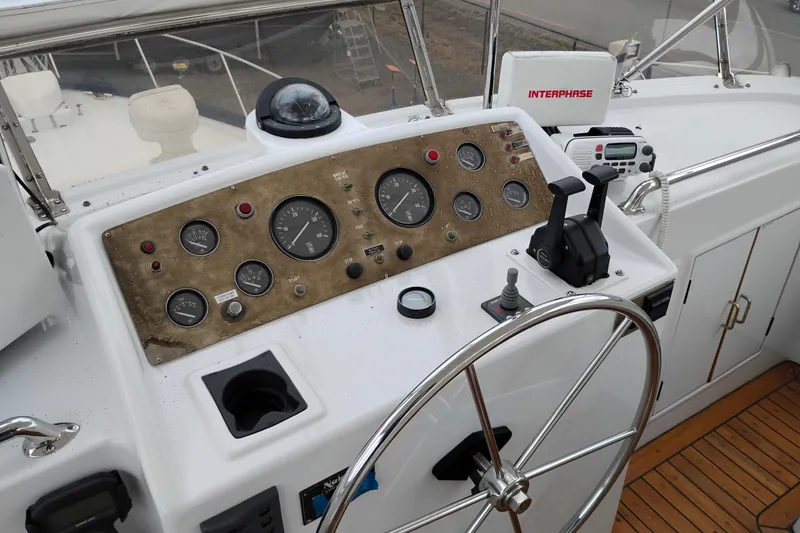 Slide: The Image of 1985 Ocean Alexander Custom Aft Deck Motoryacht helm with gauges and controls. - 20