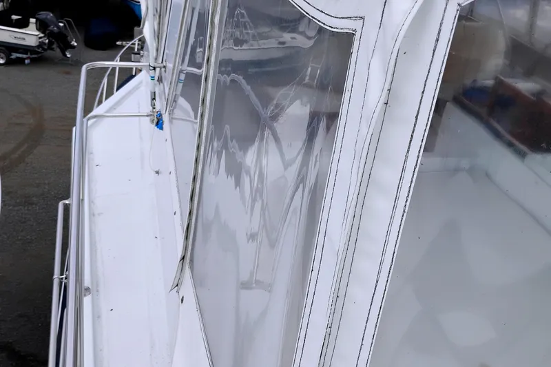 Slide: The Image of 1985 Ocean Alexander Custom Aft Deck Motoryacht with clear enclosure panels. - 22