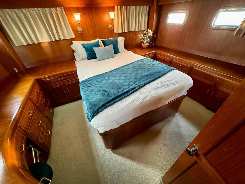 Slide: The Image of Luxurious bedroom in 1985 Ocean Alexander Custom Aft Deck Motoryacht with elegant wood finish. - 27