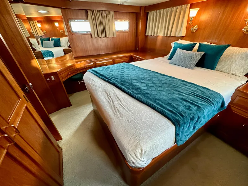 Slide: The Image of Luxurious bedroom in 1985 Ocean Alexander Custom Aft Deck Motoryacht with elegant wood finish. - 32