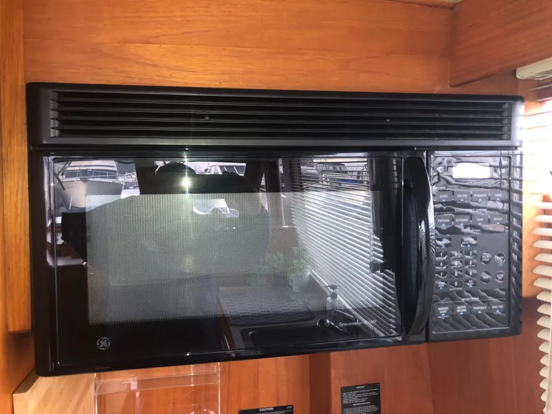 Slide: The Image of Black microwave in 1985 Ocean Alexander Custom Aft Deck Motoryacht kitchen. - 44