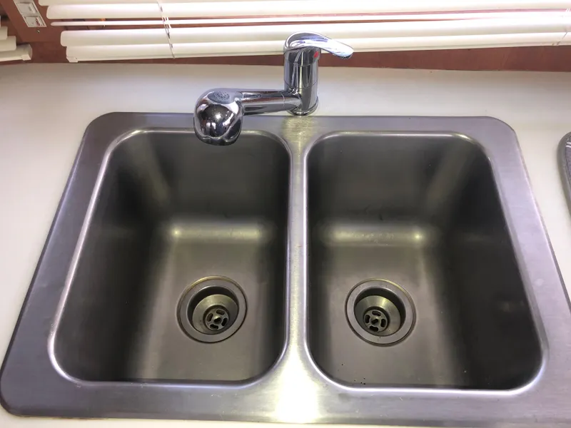 Slide: The Image of Stainless steel double sink with chrome faucet on Ocean Alexander 1985 motoryacht. - 45