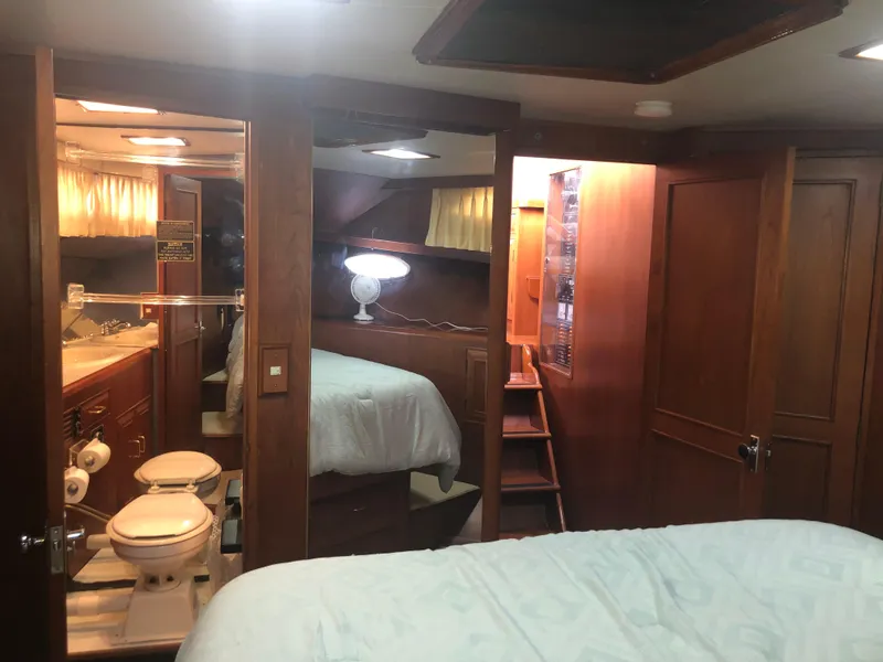 Slide: The Image of Luxurious interior of 1985 Ocean Alexander Custom Aft Deck Motoryacht with wood finishes. - 46