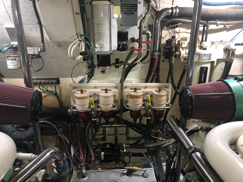 Slide: The Image of Engine room of 1985 Ocean Alexander Custom Aft Deck Motoryacht with complex machinery and filters. - 50