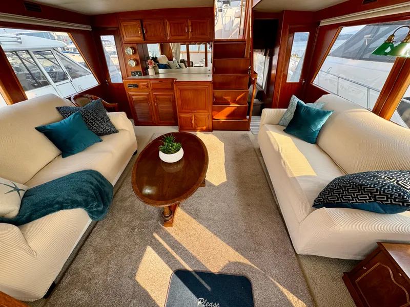 Slide: The Image of Luxurious 1985 Ocean Alexander motoryacht interior with elegant seating and wooden accents. - 8